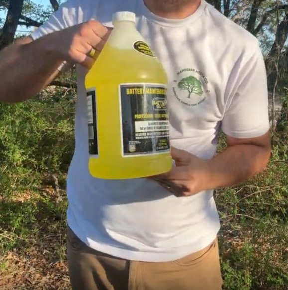 A close angle of the product being held, focused on hand placement and the label angle. Caption: Scale example 3. Product angle and hand placement help communicate handling.